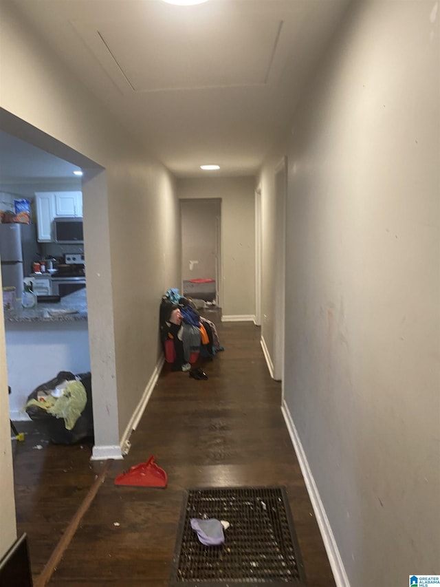 corridor featuring dark hardwood / wood-style flooring