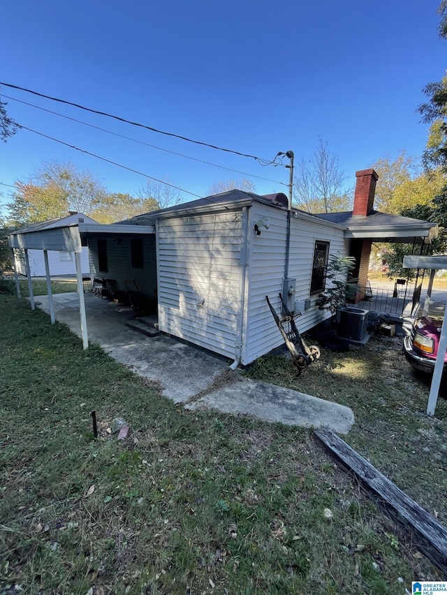 view of property exterior featuring a lawn