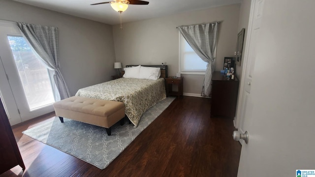 bedroom featuring dark hardwood / wood-style floors and ceiling fan