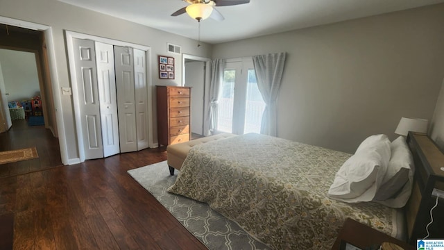 bedroom with a closet, ceiling fan, and dark wood-type flooring