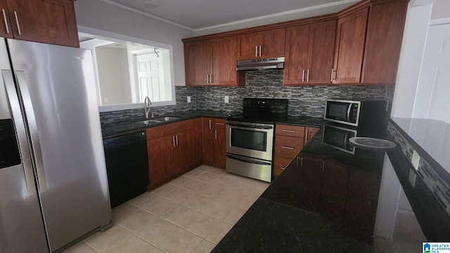 kitchen with sink, stainless steel appliances, dark stone countertops, crown molding, and decorative backsplash