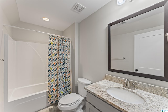 full bathroom with shower / bath combo, vanity, and toilet