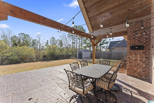 view of patio with a storage unit