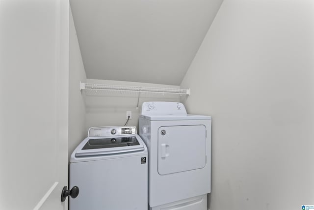 washroom featuring washer and clothes dryer