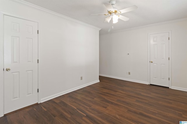 spare room with dark hardwood / wood-style flooring, ceiling fan, and ornamental molding