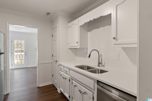 kitchen with white cabinets, dark hardwood / wood-style floors, stainless steel dishwasher, and sink