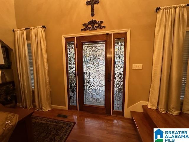 foyer with dark hardwood / wood-style flooring