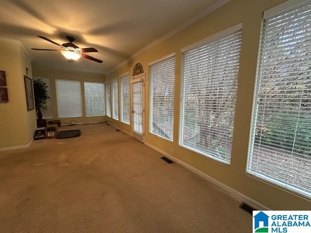 interior space with ceiling fan