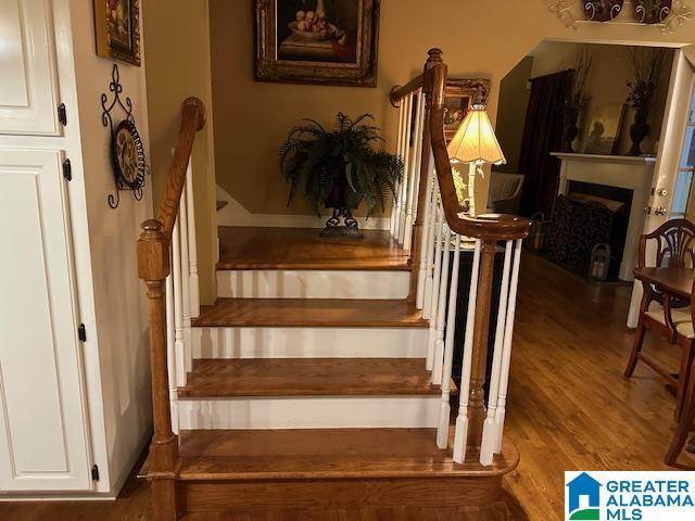 stairway featuring hardwood / wood-style flooring