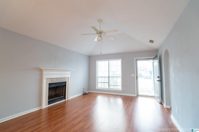 unfurnished living room featuring ceiling fan, vaulted ceiling, and light hardwood / wood-style flooring