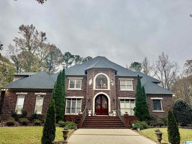 view of front of house featuring french doors and a front yard