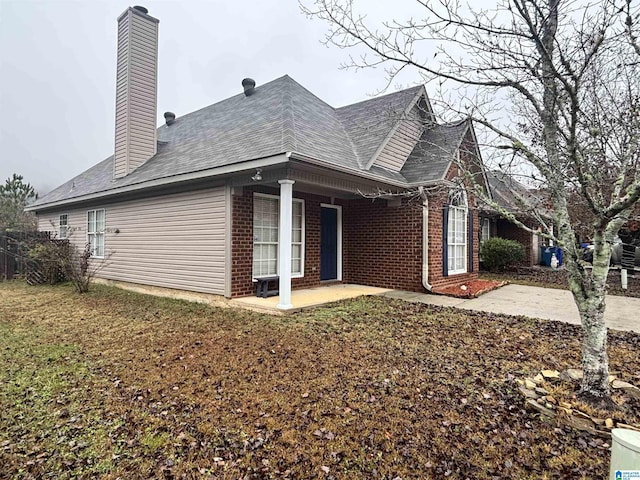 view of home's exterior with a patio area