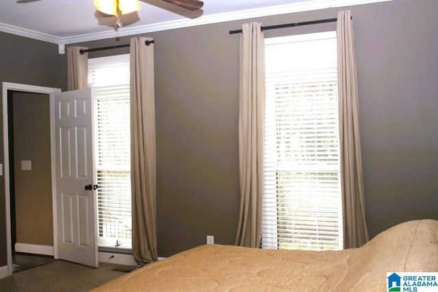 bedroom with multiple windows, ceiling fan, and crown molding