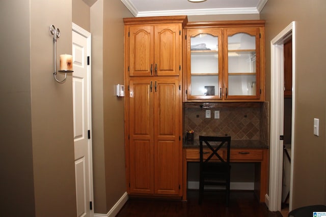 kitchen featuring crown molding and backsplash