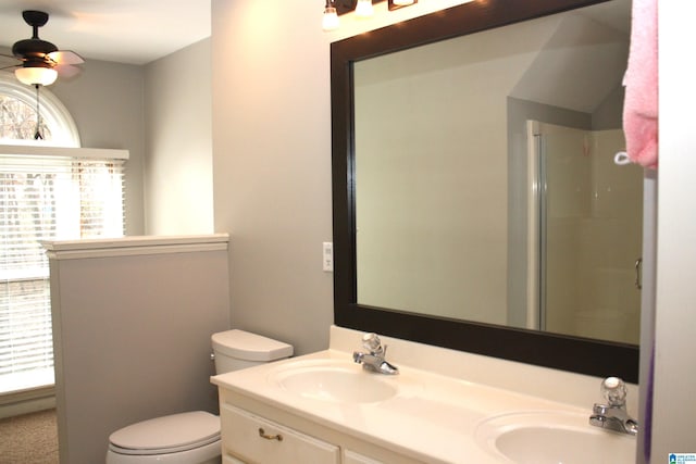 bathroom with walk in shower, vanity, ceiling fan, and a healthy amount of sunlight