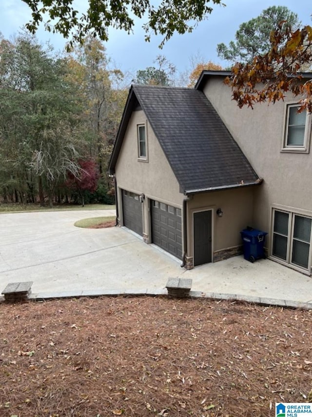 view of property exterior featuring a garage