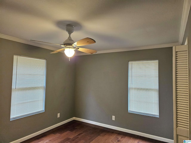 spare room featuring ceiling fan, dark hardwood / wood-style flooring, and ornamental molding