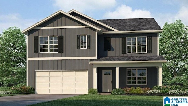 view of front of home with a front yard and a garage