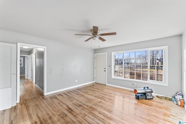 empty room featuring ceiling fan and light wood-type flooring