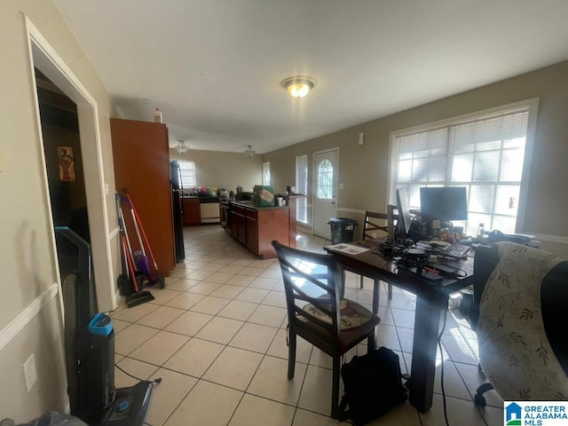 tiled dining space featuring ceiling fan