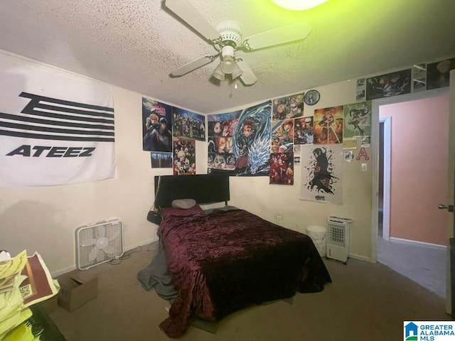 carpeted bedroom with a textured ceiling and ceiling fan