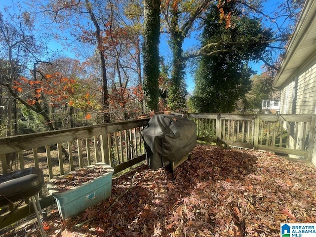 wooden terrace with area for grilling