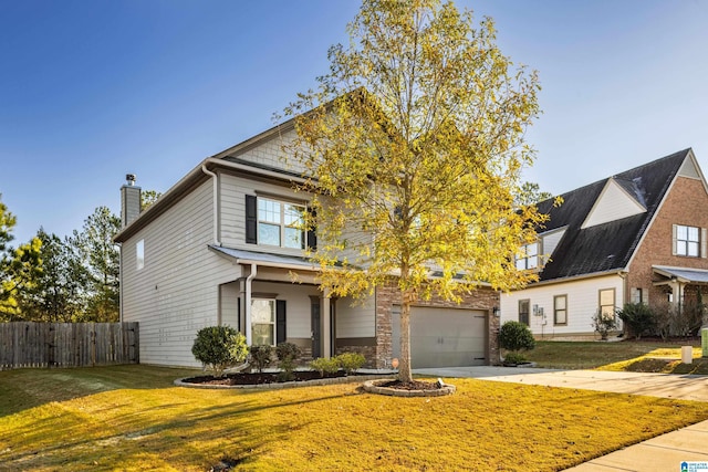 view of front of house with a front lawn and a garage