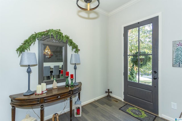 foyer entrance with dark hardwood / wood-style flooring and crown molding