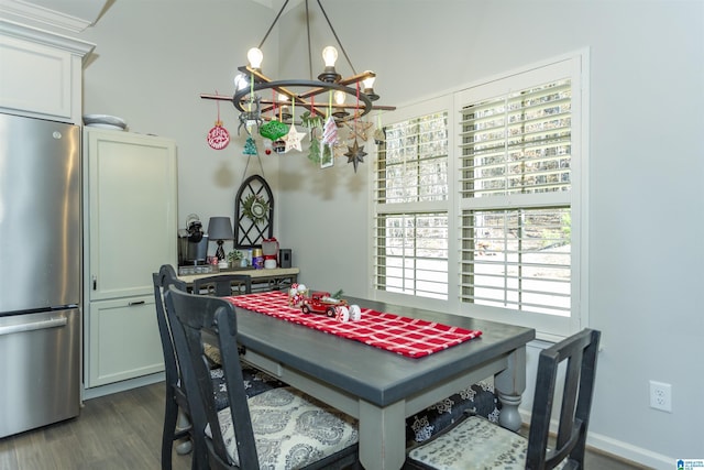 dining room with plenty of natural light, dark hardwood / wood-style floors, and a chandelier