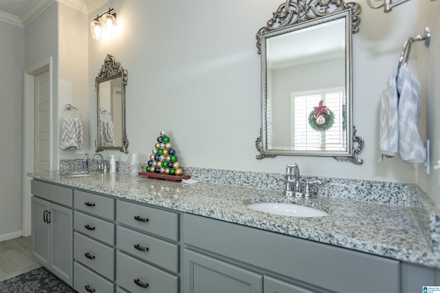 bathroom with vanity and ornamental molding