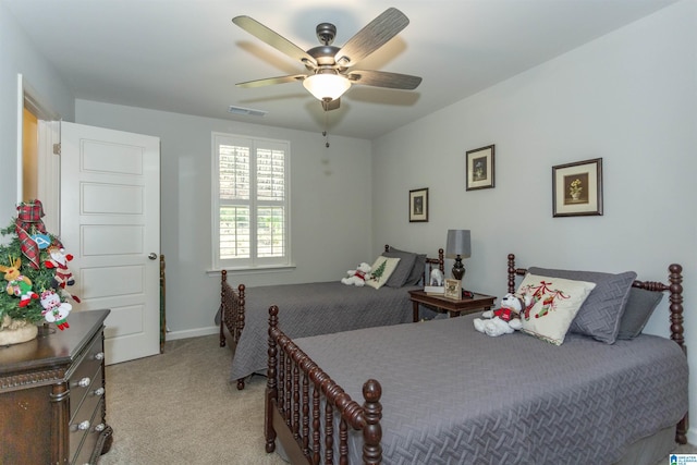 bedroom with ceiling fan and light colored carpet