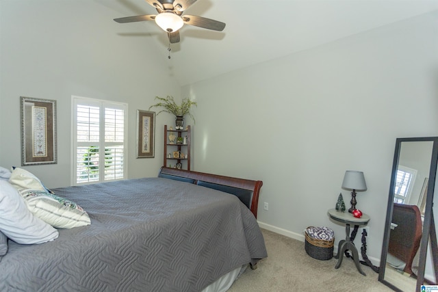 bedroom featuring ceiling fan, light carpet, and vaulted ceiling