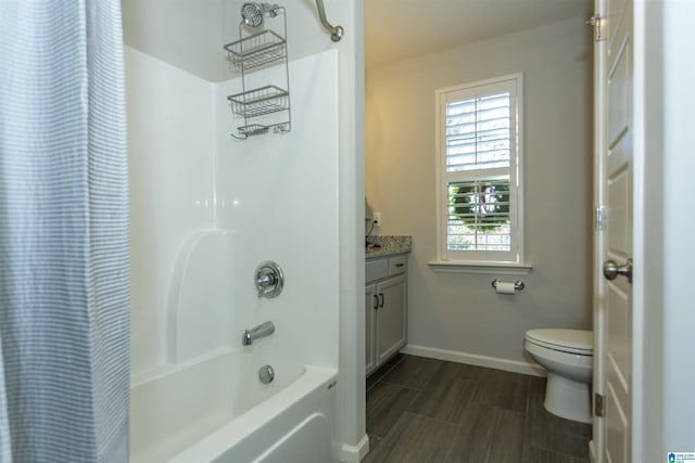 full bathroom with shower / tub combo with curtain, vanity, and toilet