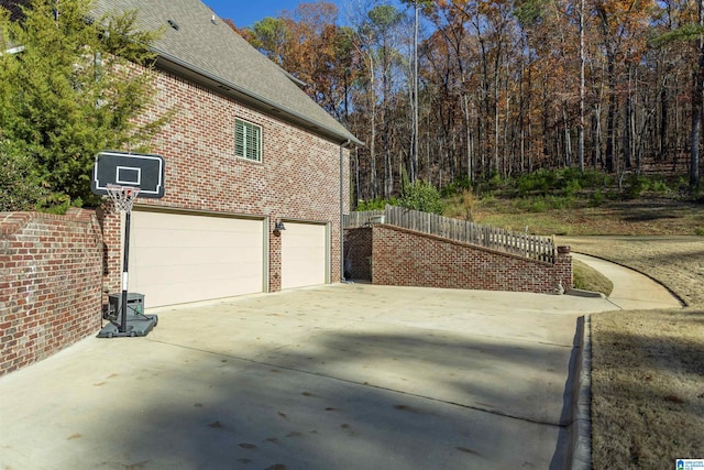 view of property exterior featuring a garage