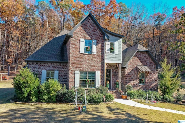 front facade with a front yard