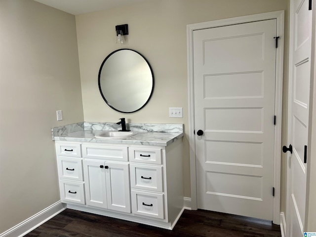 bathroom with vanity and wood-type flooring