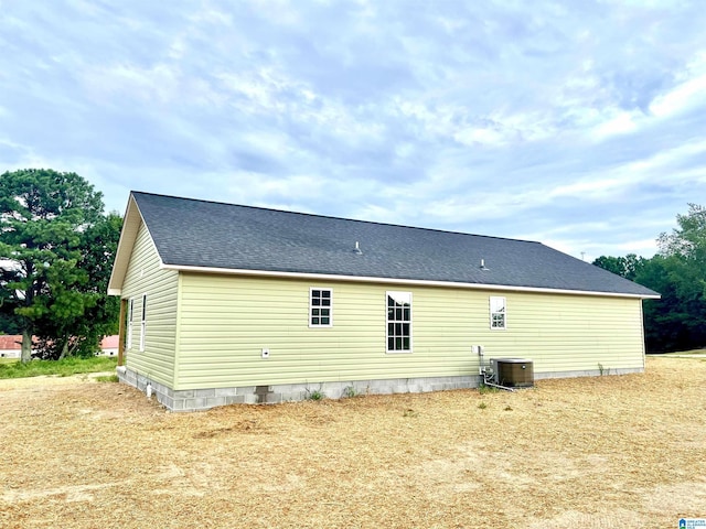 rear view of property with cooling unit