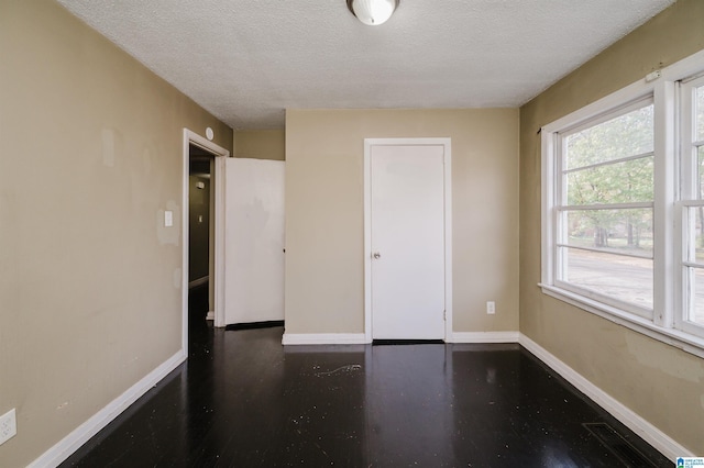 spare room featuring a textured ceiling