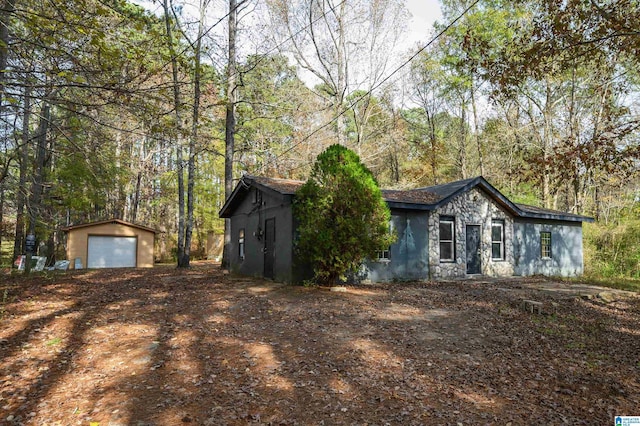 view of front facade with an outbuilding and a garage