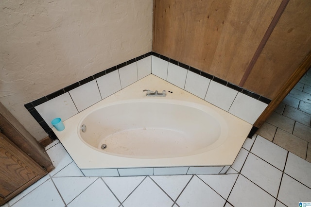 bathroom featuring a relaxing tiled tub