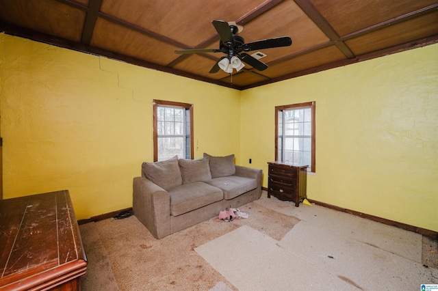 carpeted living room featuring plenty of natural light, ceiling fan, and wooden ceiling