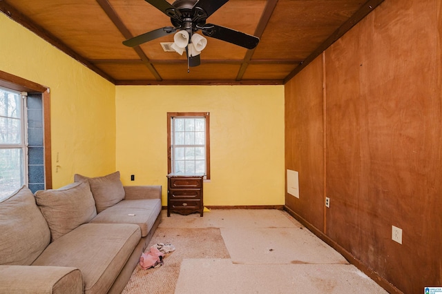 living room with ceiling fan, light colored carpet, and wooden ceiling