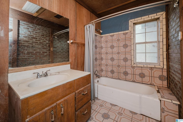 bathroom featuring wooden walls, vanity, and shower / tub combo