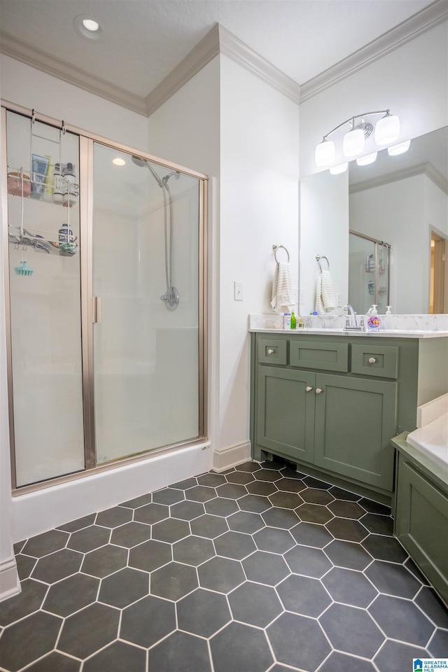 bathroom with vanity, a shower with door, and ornamental molding