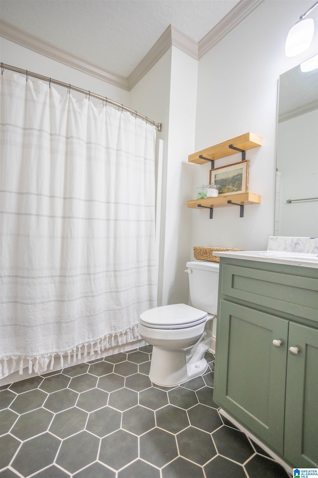 bathroom featuring vanity, toilet, and ornamental molding