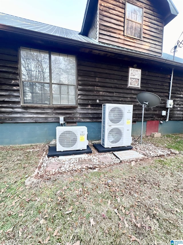 exterior space with ac unit