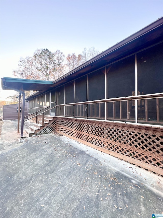 view of side of property with a sunroom