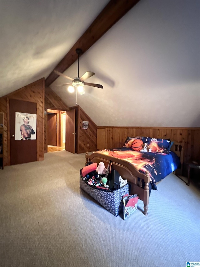 carpeted bedroom with vaulted ceiling with beams, ceiling fan, and wooden walls