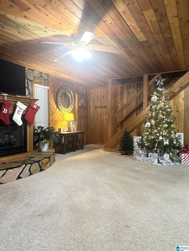 basement with wood walls, carpet floors, and wooden ceiling