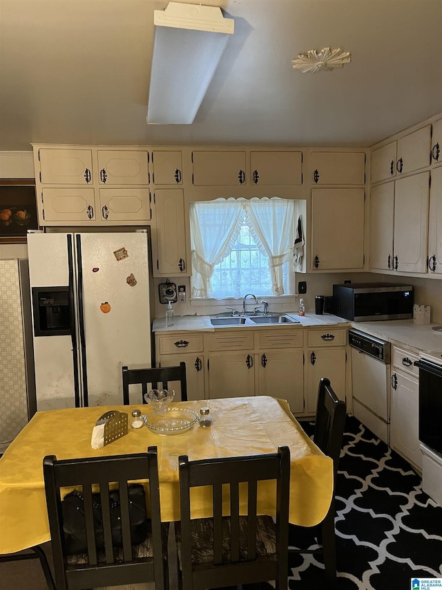 kitchen featuring sink and white appliances